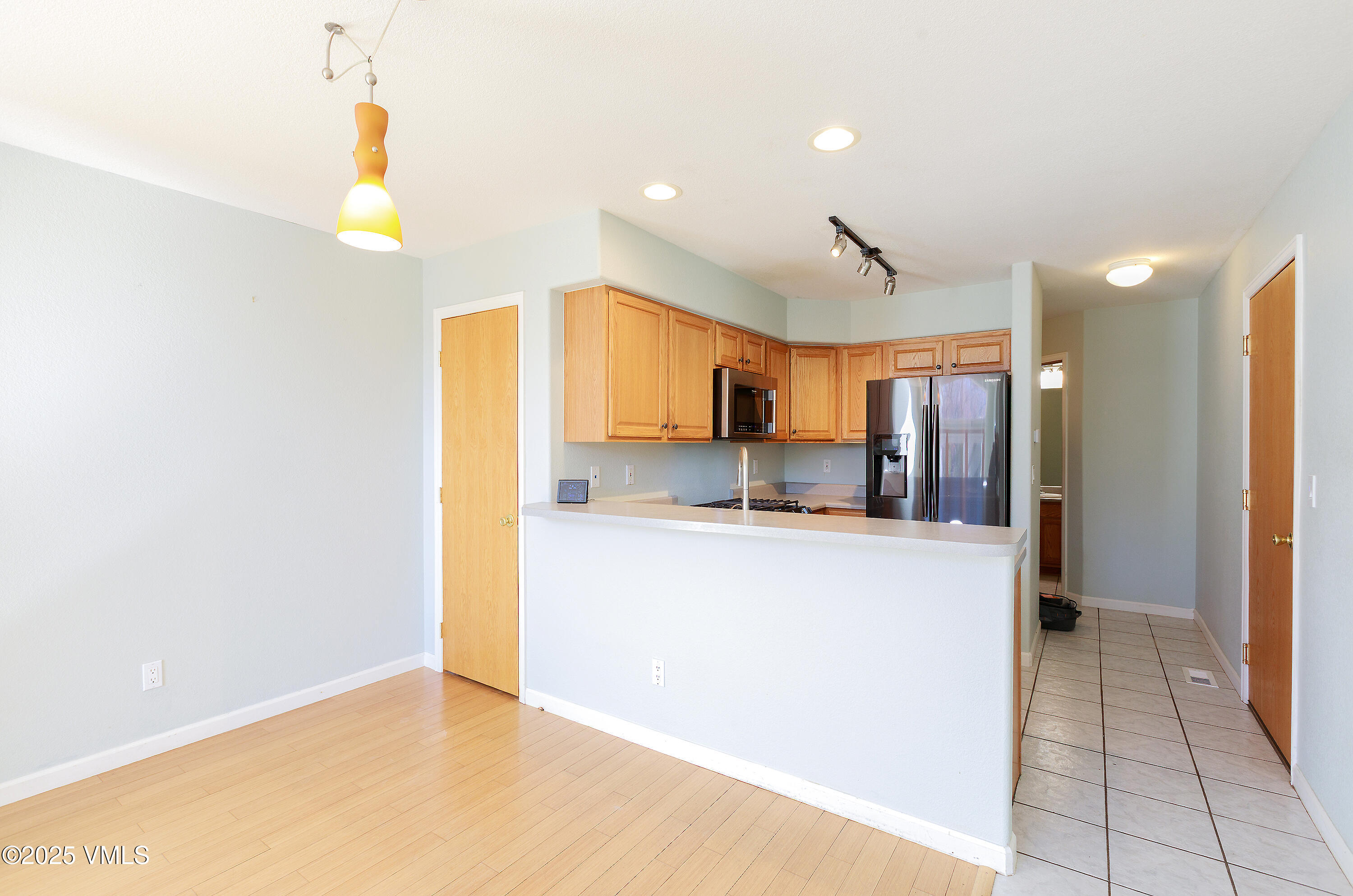 510 Brush Creek Terrace, Unit G3 Eagle, CO 81631 - Photo 7 of 29 a kitchen with stainless steel appliances a refrigerator and a stove top oven