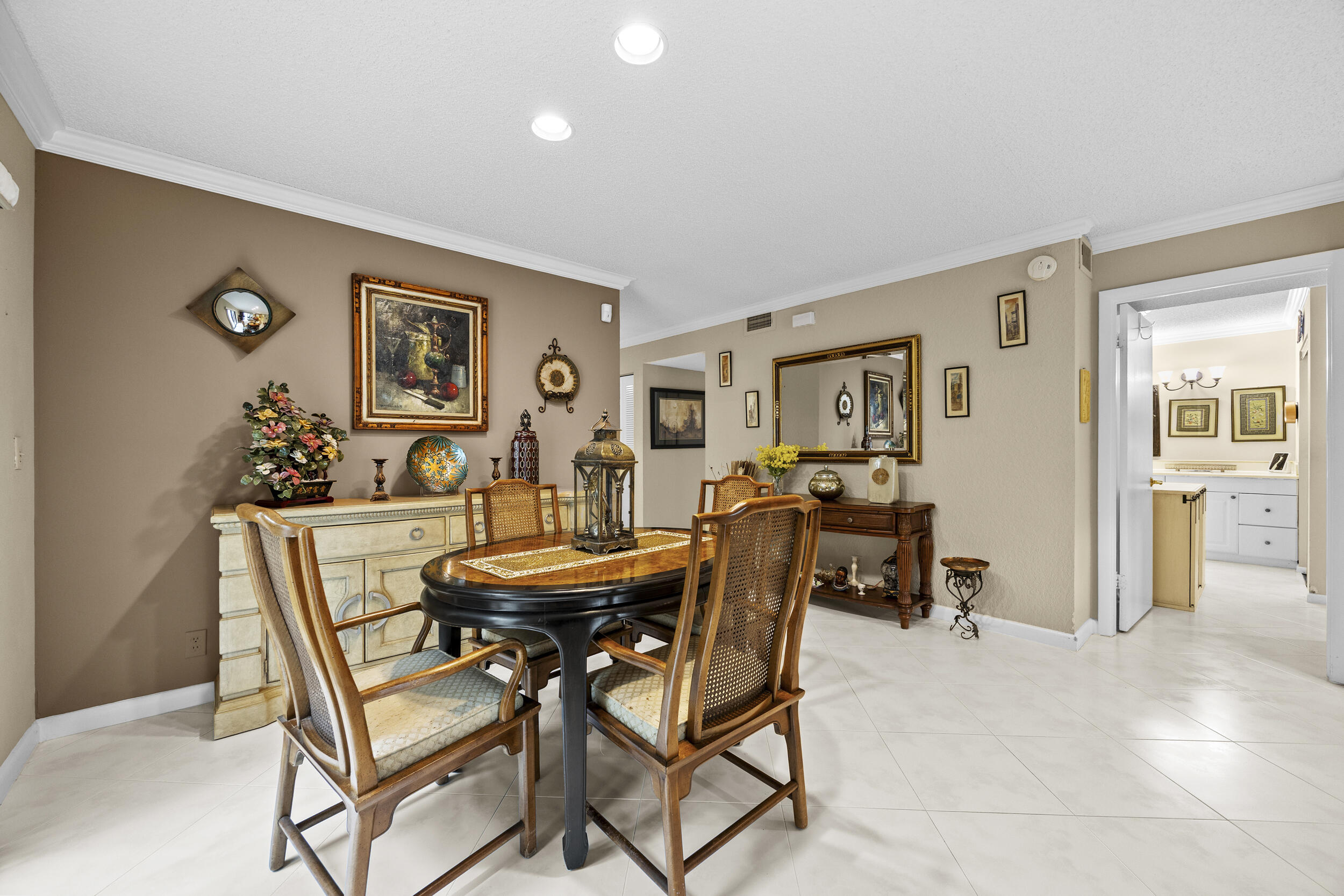 21691 Tall Palm Circle, Unit 3C Boca Raton, FL 33433 - Photo 11 of 48 a view of a dining room with furniture