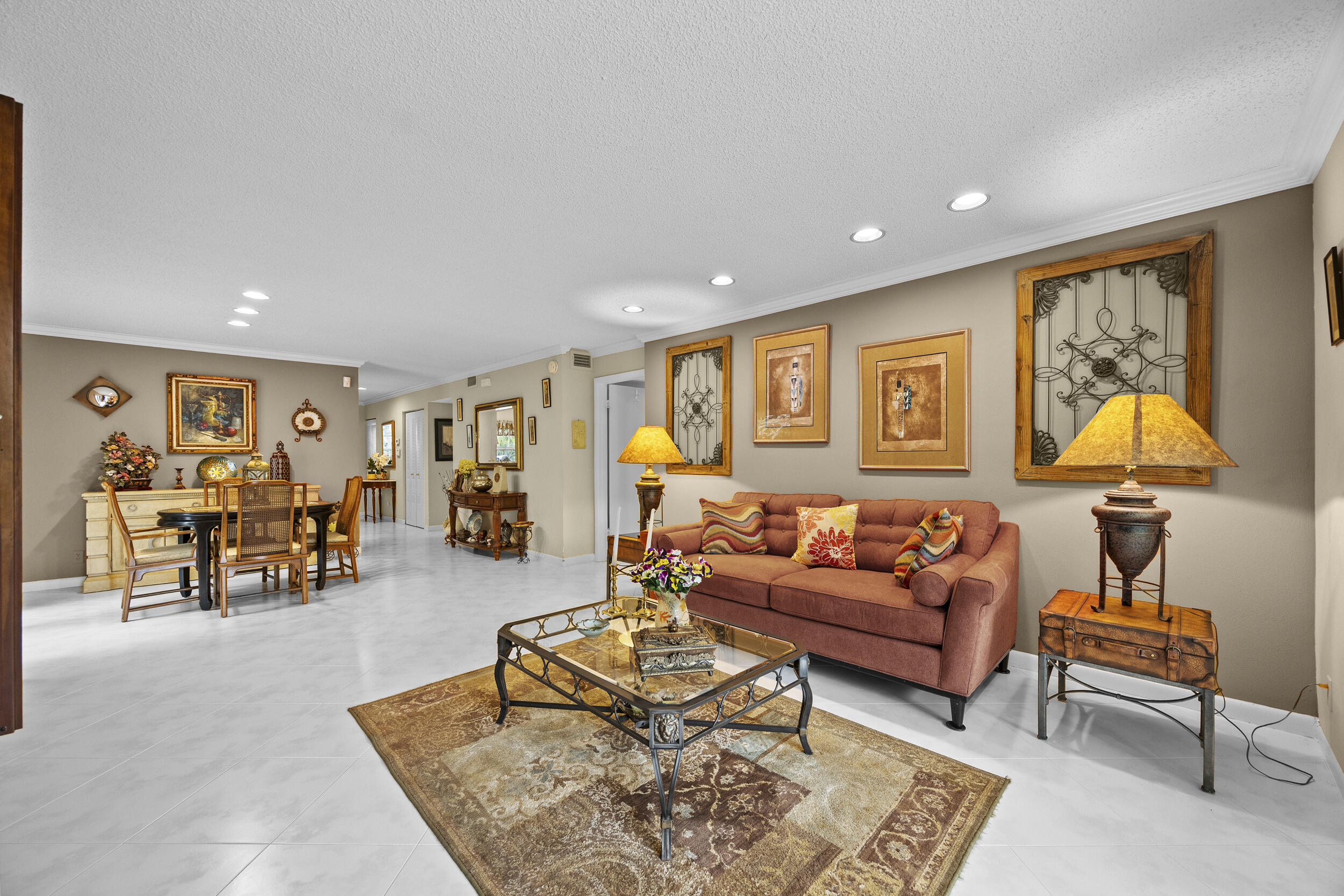 21691 Tall Palm Circle, Unit 3C Boca Raton, FL 33433 - Photo 14 of 48 a living room with furniture and wooden floor