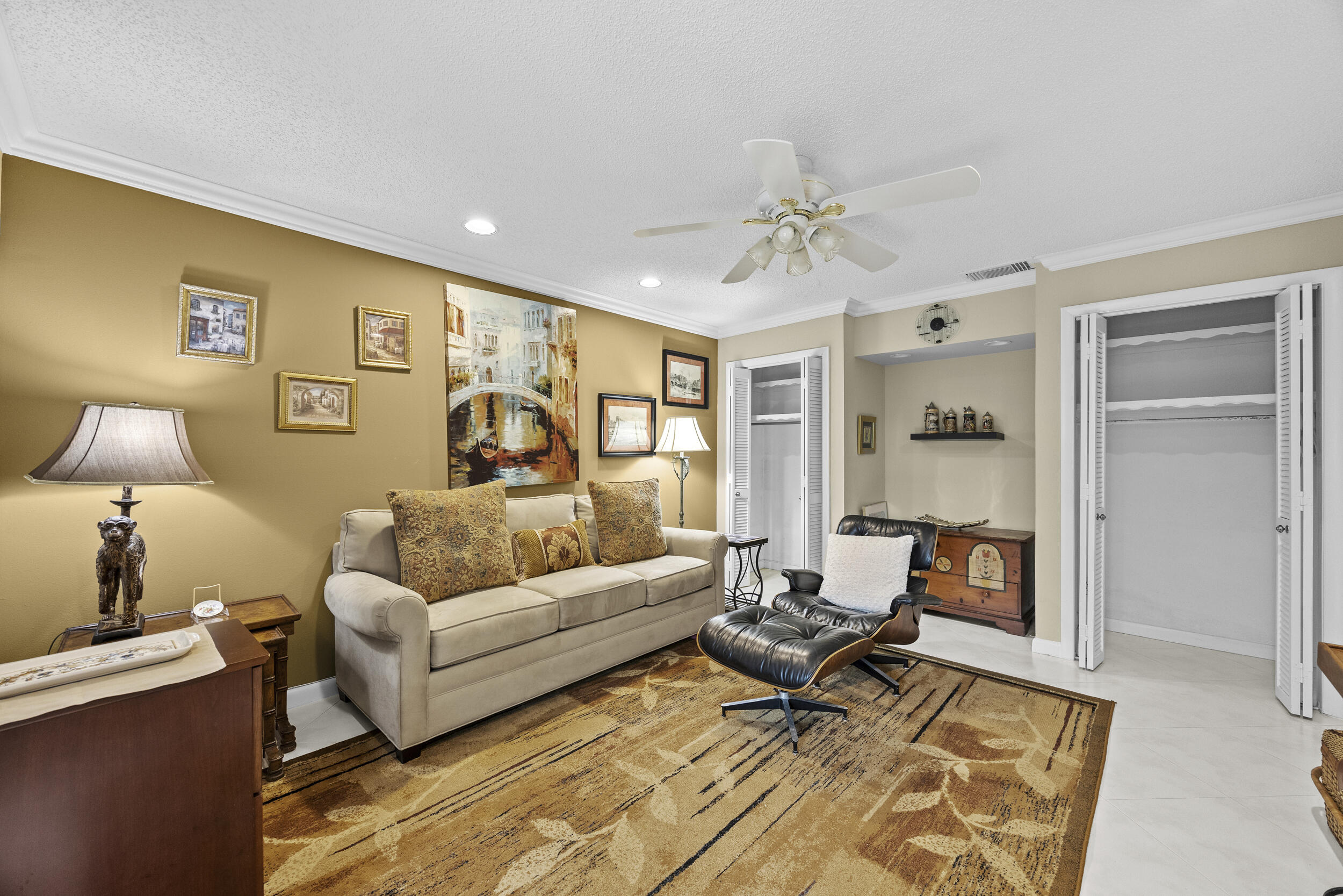 21691 Tall Palm Circle, Unit 3C Boca Raton, FL 33433 - Photo 17 of 48 a living room with furniture and a lamp