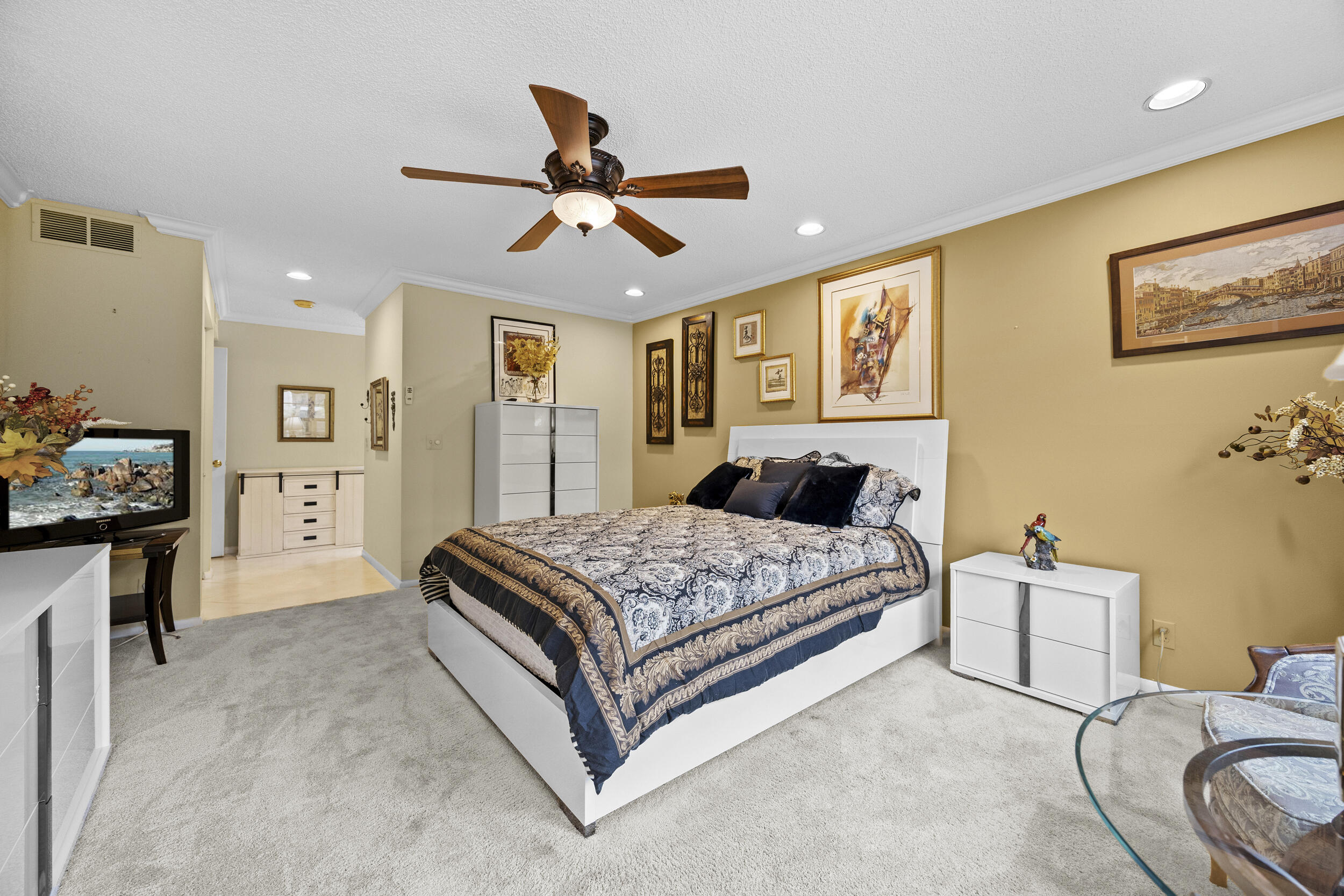 21691 Tall Palm Circle, Unit 3C Boca Raton, FL 33433 - Photo 26 of 48 a bed room with a bed and a chandelier