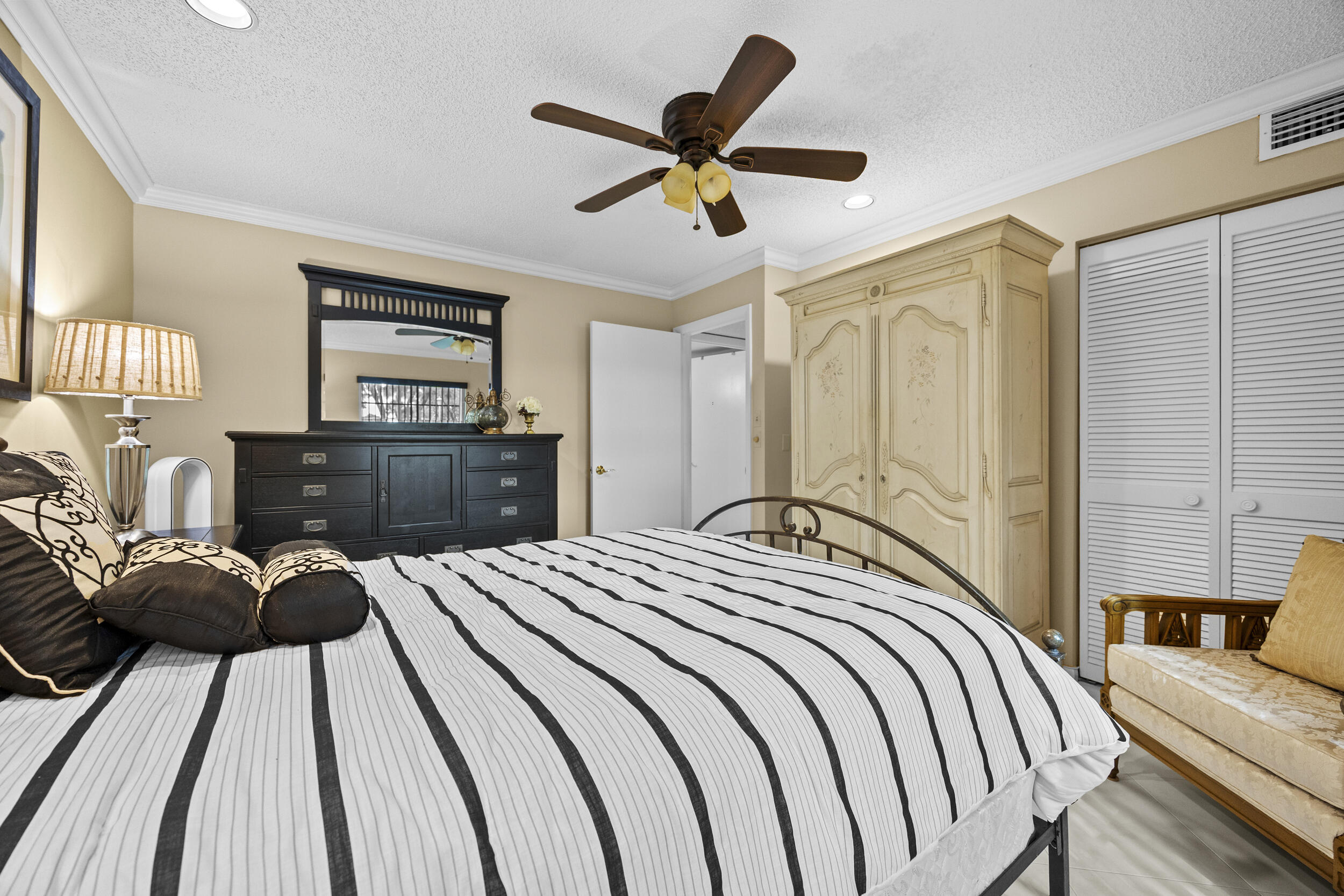 21691 Tall Palm Circle, Unit 3C Boca Raton, FL 33433 - Photo 32 of 48 a bedroom with a bed and window