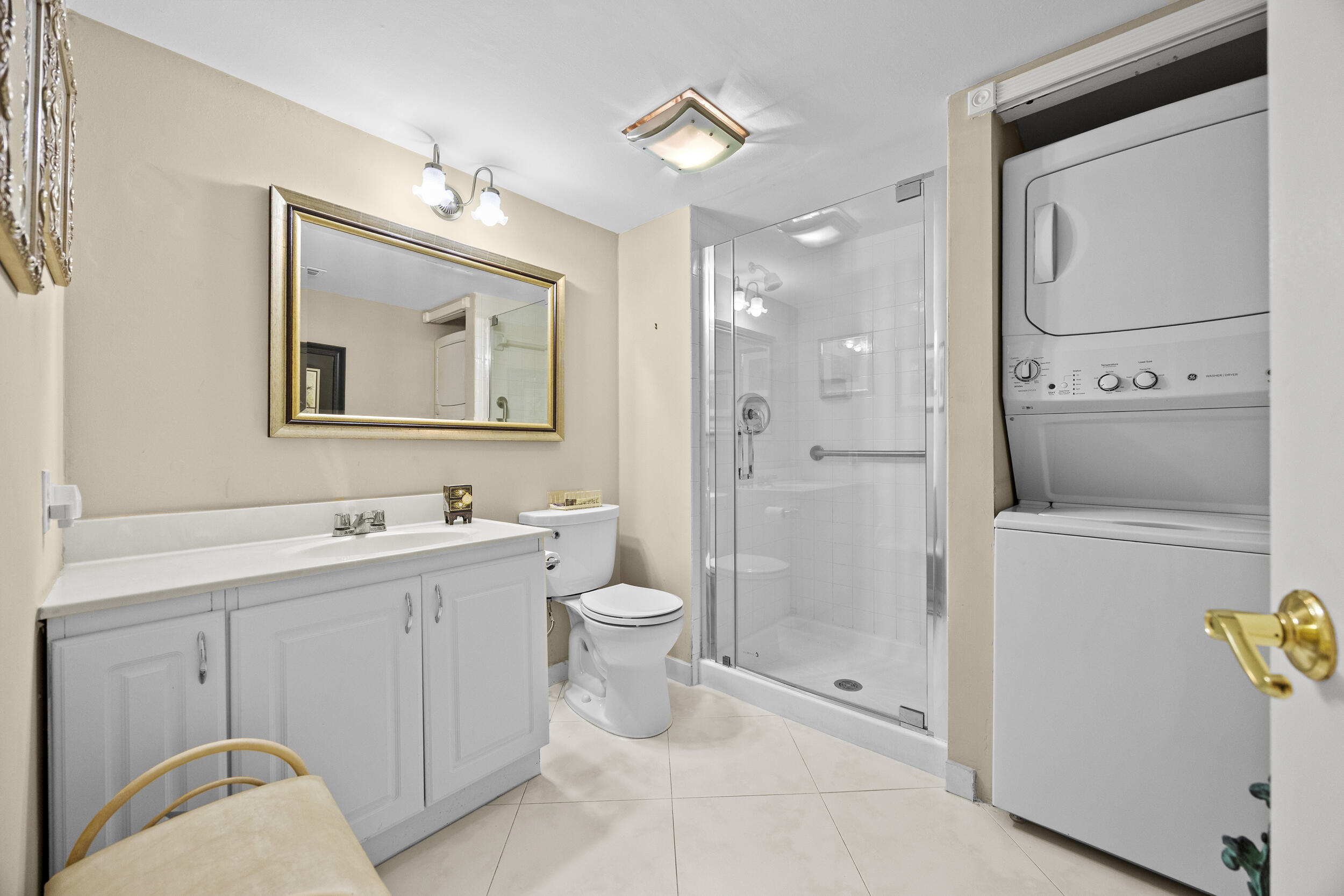 21691 Tall Palm Circle, Unit 3C Boca Raton, FL 33433 - Photo 35 of 48 a bathroom with a toilet sink and shower