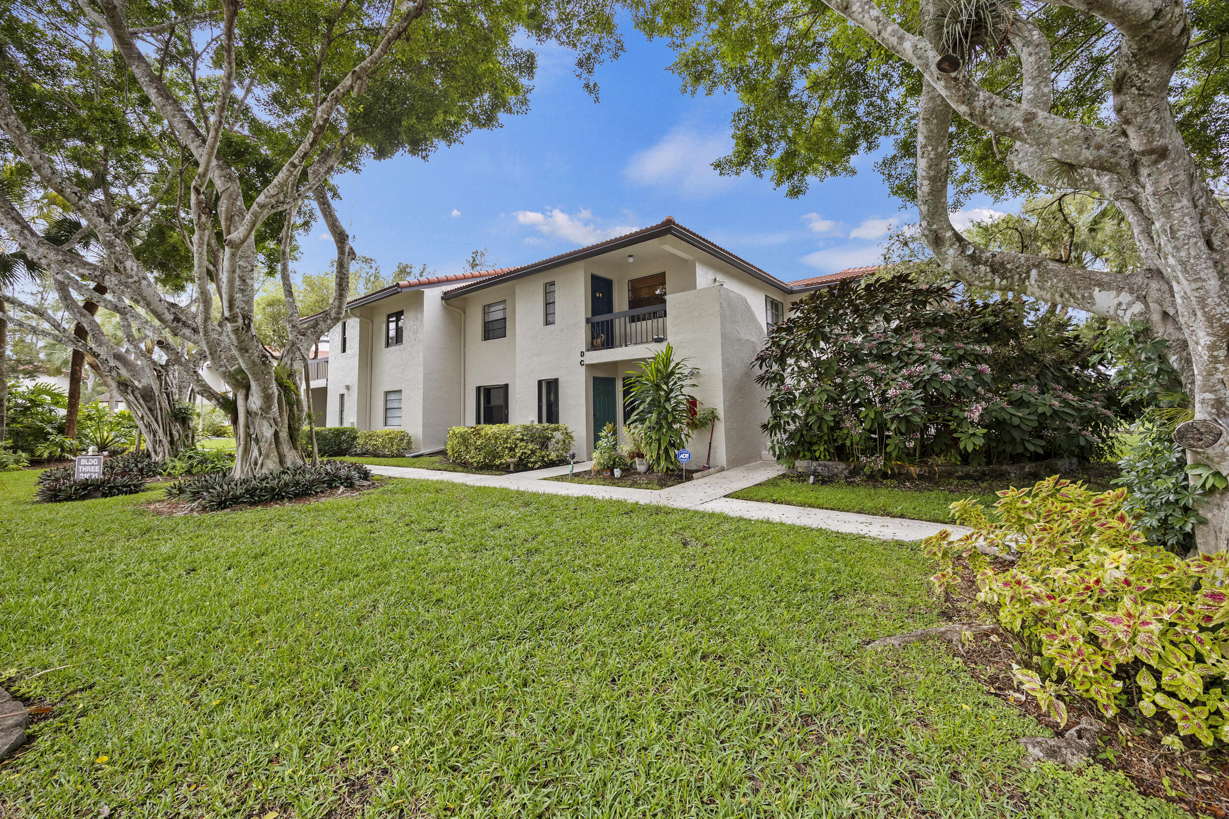 21691 Tall Palm Circle, Unit 3C Boca Raton, FL 33433 - Photo 36 of 48 a view of a house with a yard