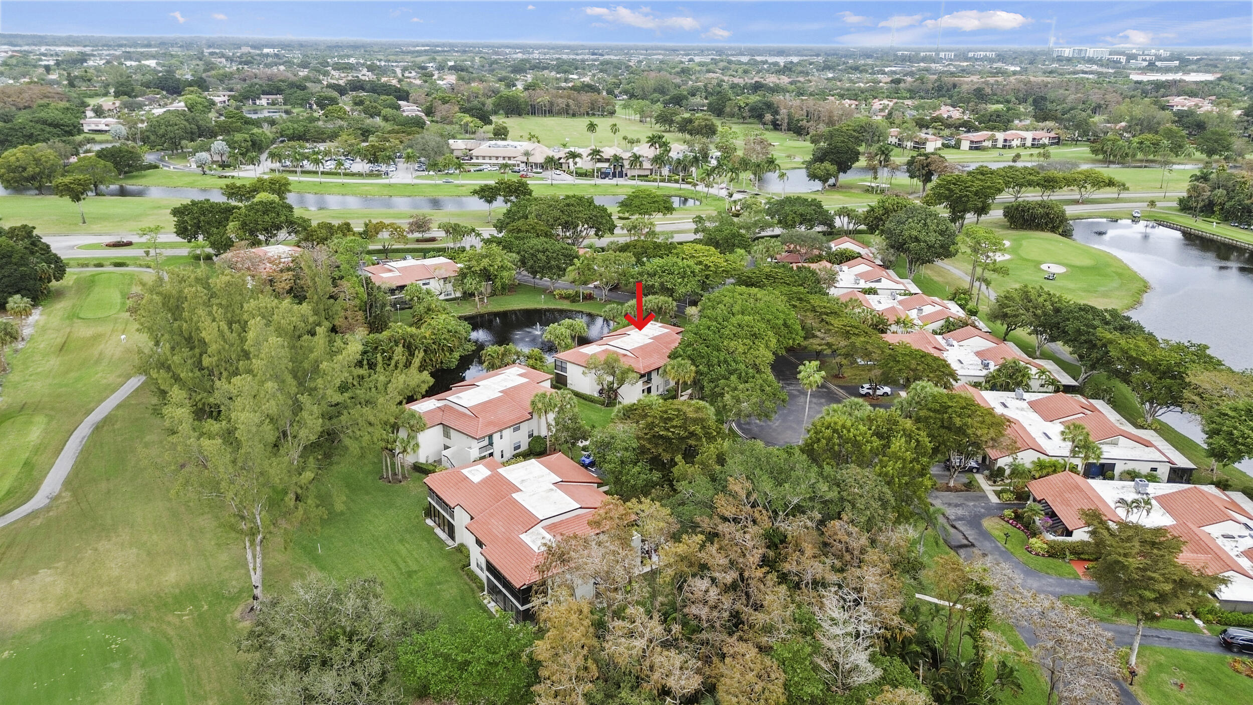 21691 Tall Palm Circle, Unit 3C Boca Raton, FL 33433 - Photo 40 of 48 an aerial view of residential houses with outdoor space and trees