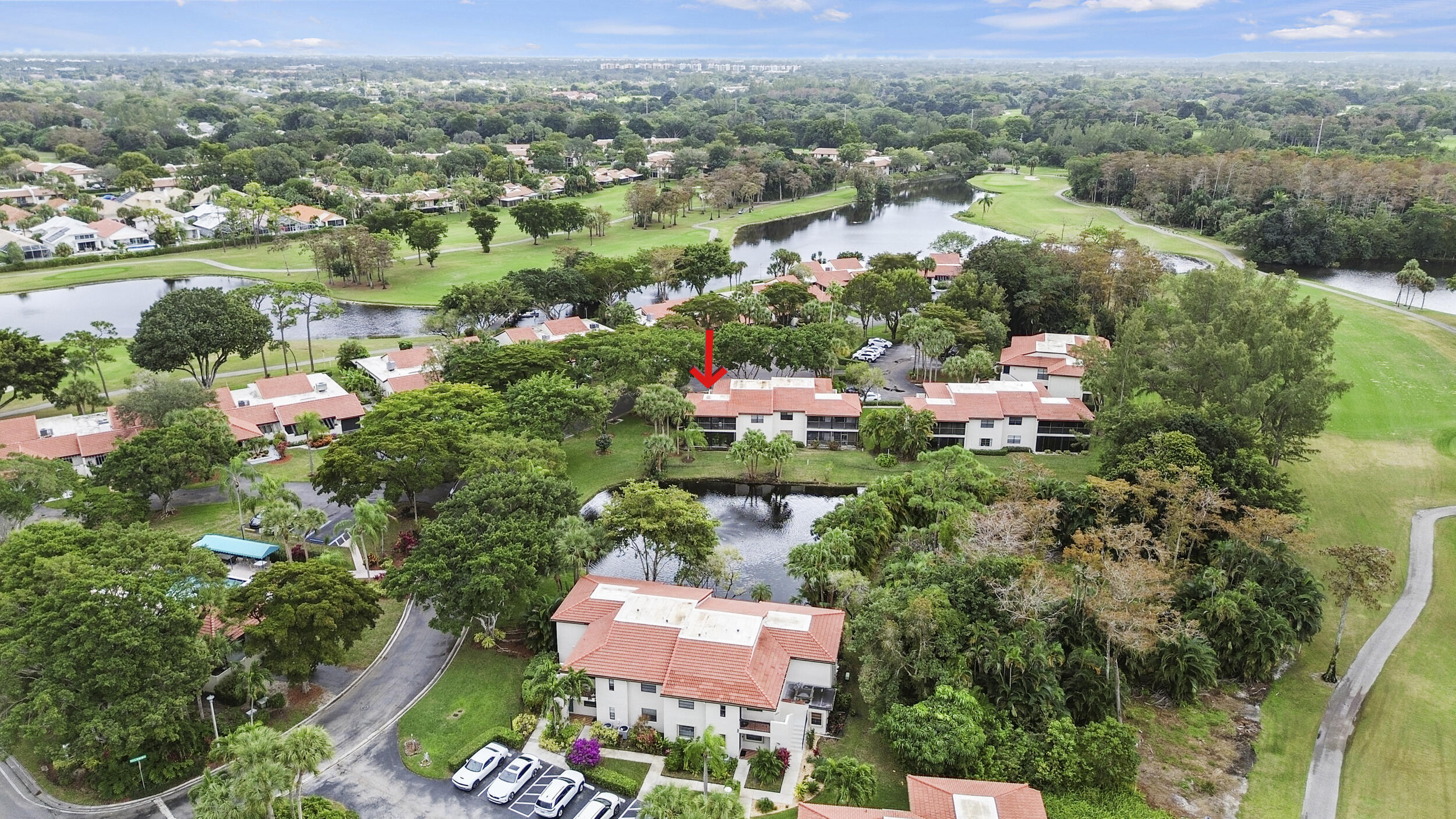 21691 Tall Palm Circle, Unit 3C Boca Raton, FL 33433 - Photo 43 of 48 an aerial view of residential houses with outdoor space and river