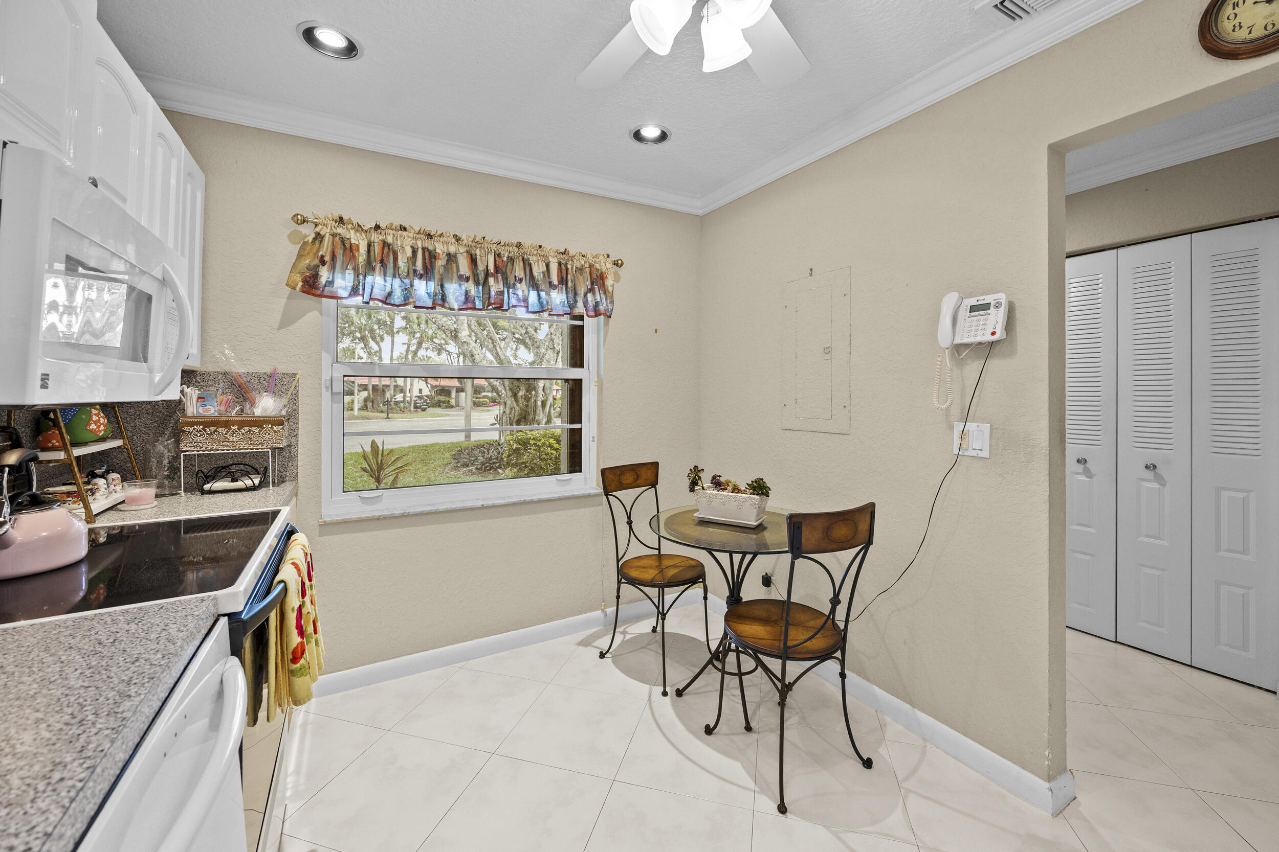 21691 Tall Palm Circle, Unit 3C Boca Raton, FL 33433 - Photo 6 of 48 a dining room with furniture and window