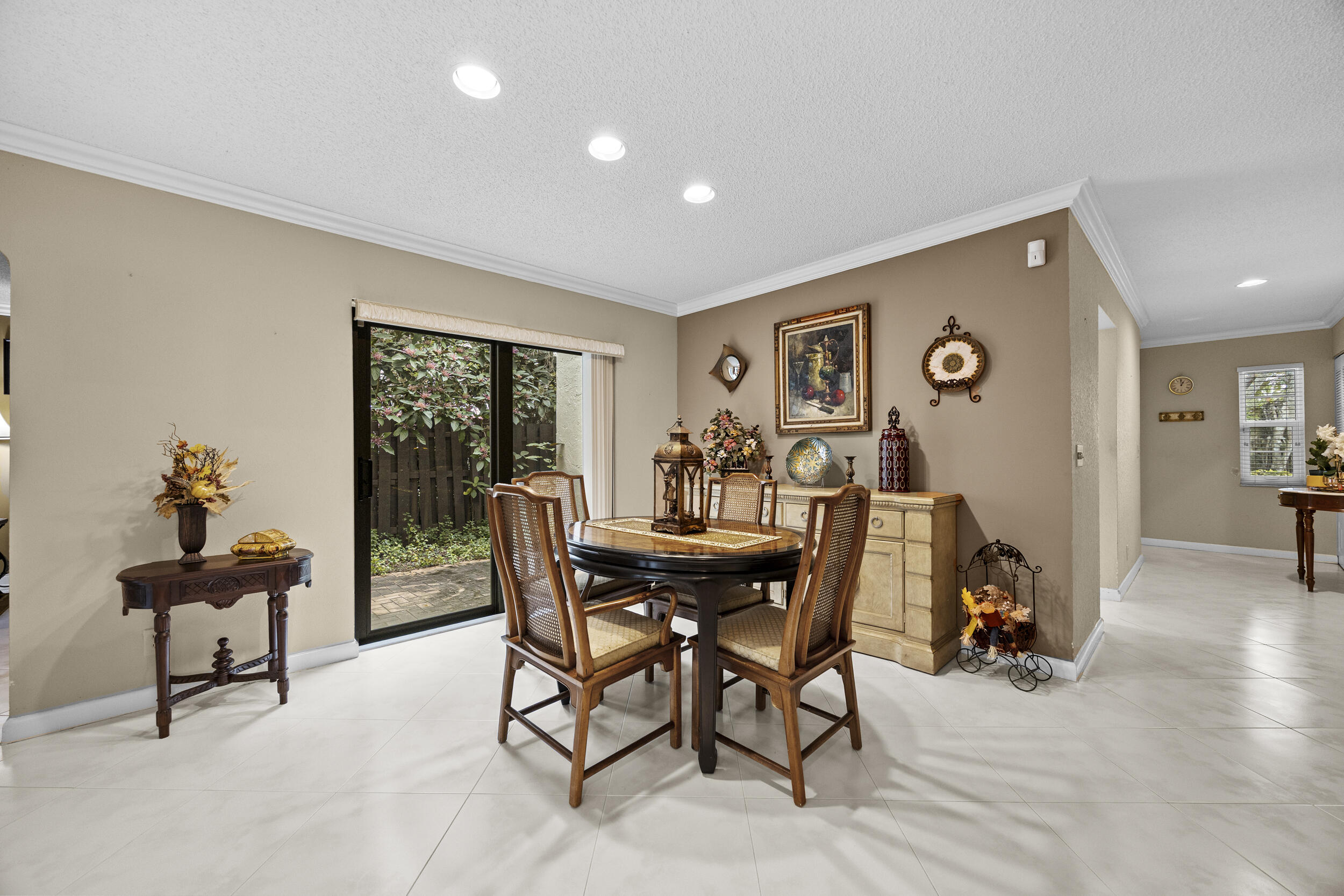 21691 Tall Palm Circle, Unit 3C Boca Raton, FL 33433 - Photo 7 of 48 a view of a dining room with furniture and a livingroom