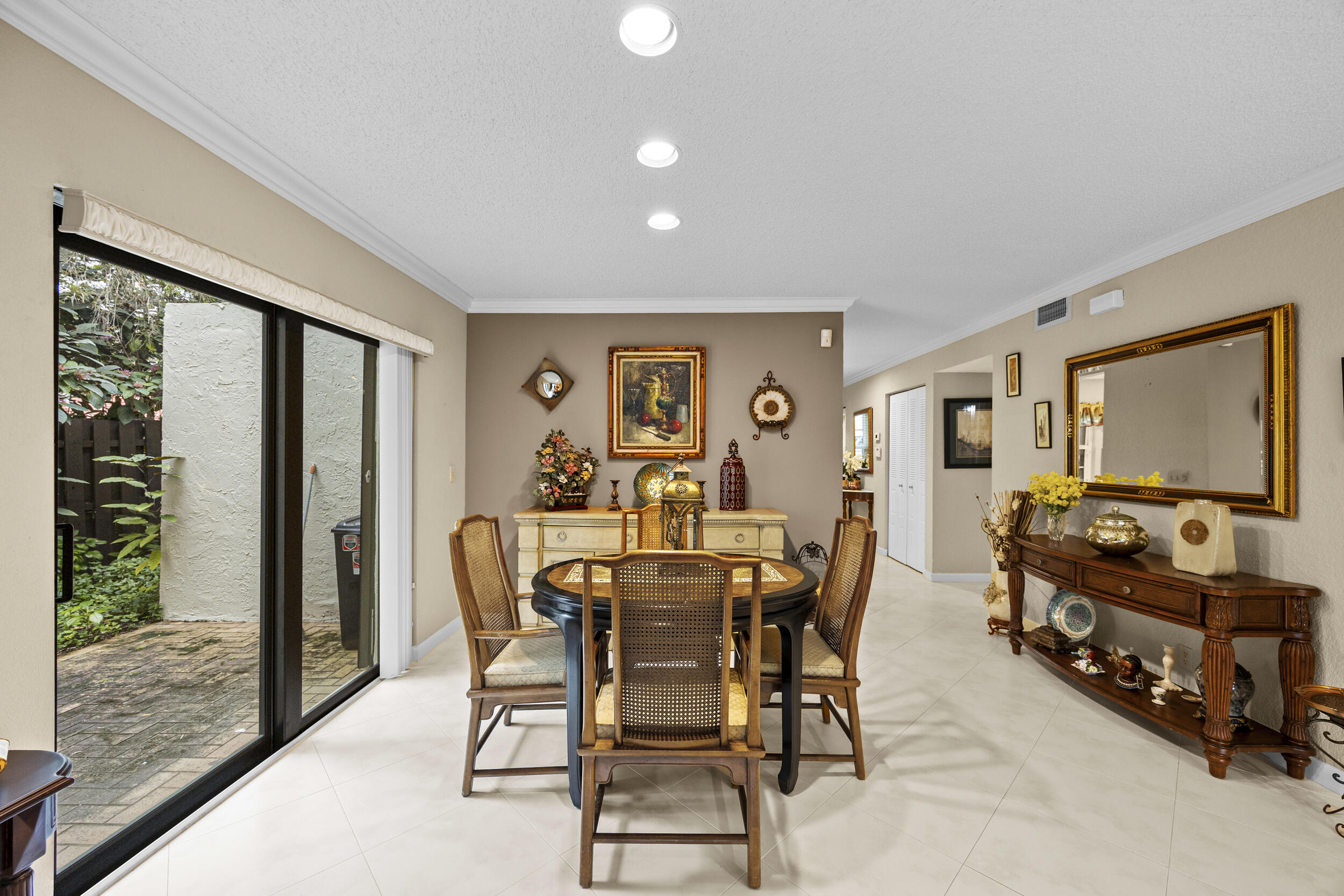21691 Tall Palm Circle, Unit 3C Boca Raton, FL 33433 - Photo 9 of 48 a view of a livingroom with furniture and front door