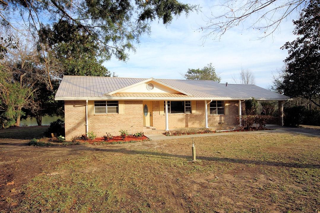 5643 Old Bethel Road Crestview, FL 32536 - Photo 1 of 23 a front view of a house with a yard