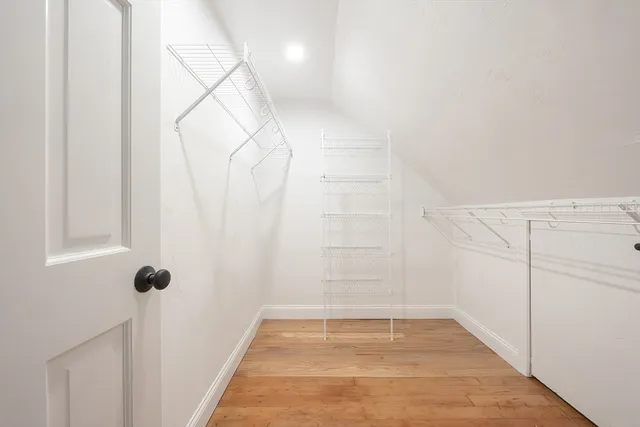 a view of a room with white walls