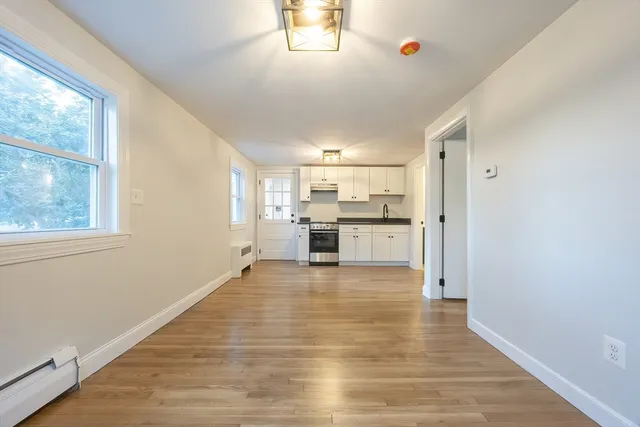 a view of kitchen with wooden floor