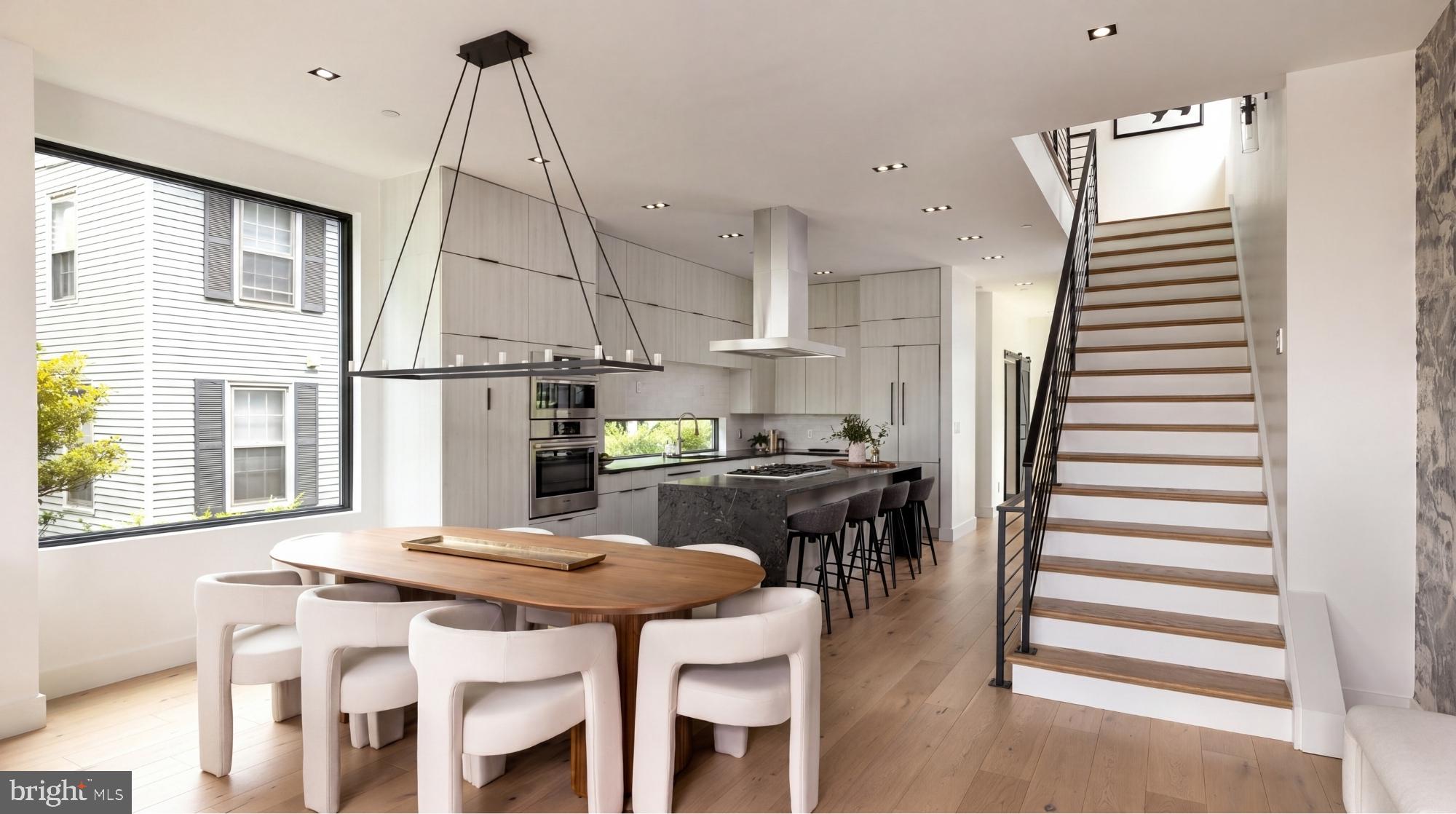 1522 Foxhall Road Northwest Washington, DC 20007 - Photo 18 of 47 a kitchen with a table chairs and a wooden floor