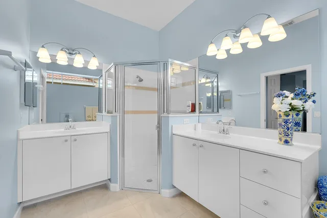 a bathroom with a sink vanity and a mirror