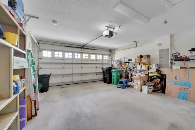 a view of a garage with rack and bicycle