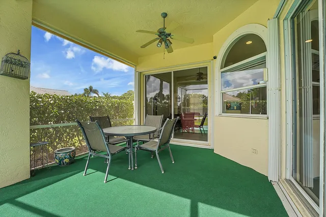 a view of a patio with a table and chairs