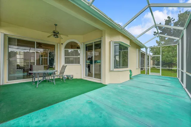 a view of an house with backyard porch and sitting area