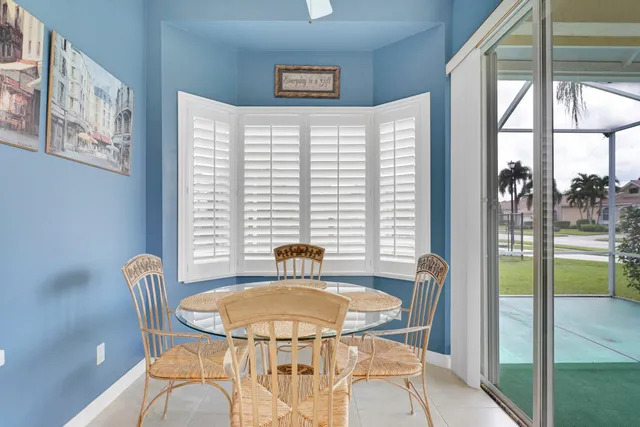 a dining room with furniture and window