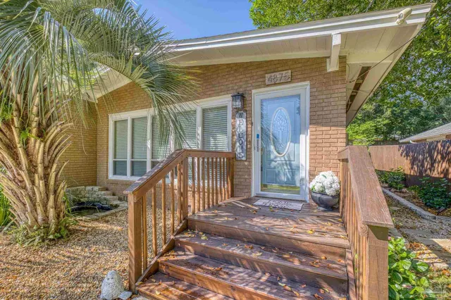 a large kitchen with stainless steel appliances kitchen island granite countertop a large counter top