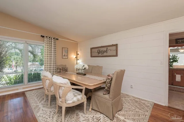 a kitchen with granite countertop a sink and a stove