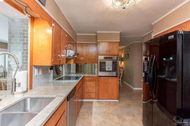 a view of a hallway with dining room and chandelier