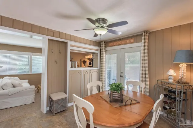 a bathroom with a granite countertop sink a mirror and shower