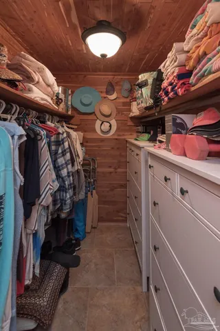 a bedroom with a bed and a mirror