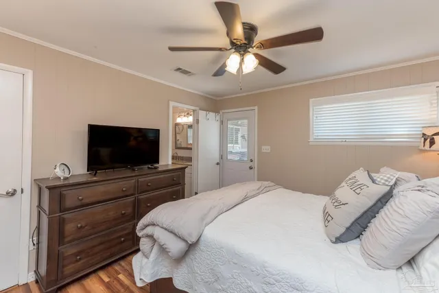 a view of a patio with table and chairs and potted plants