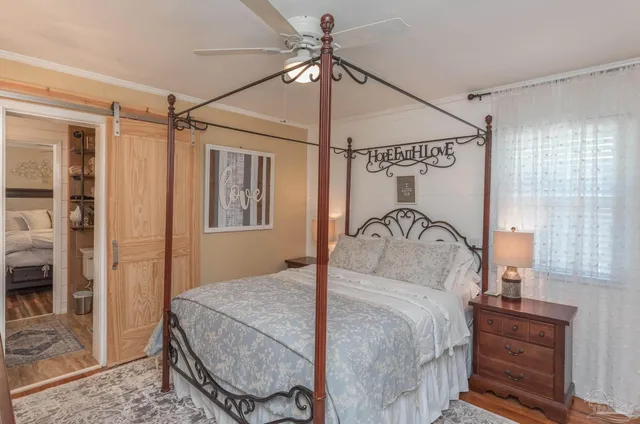 a view of a patio with table and chairs and wooden fence