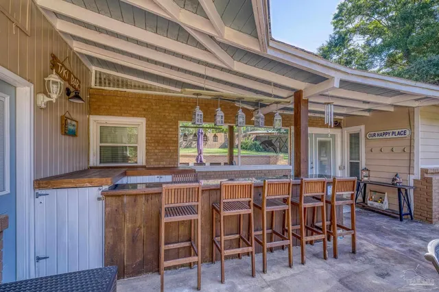 a view of a house with garden and trees