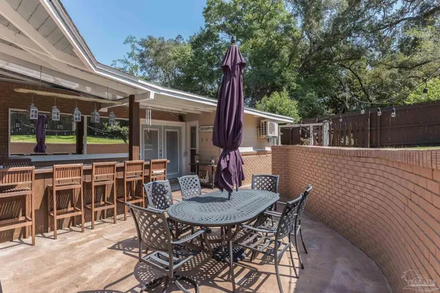 a view of house with backyard and garden