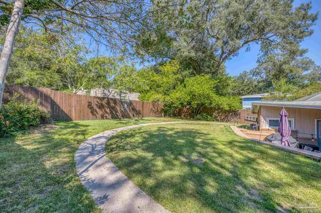 an aerial view of residential house with outdoor space