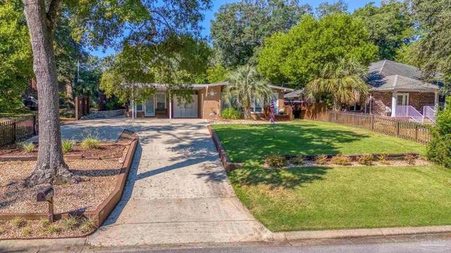 a view of a patio with table and chairs