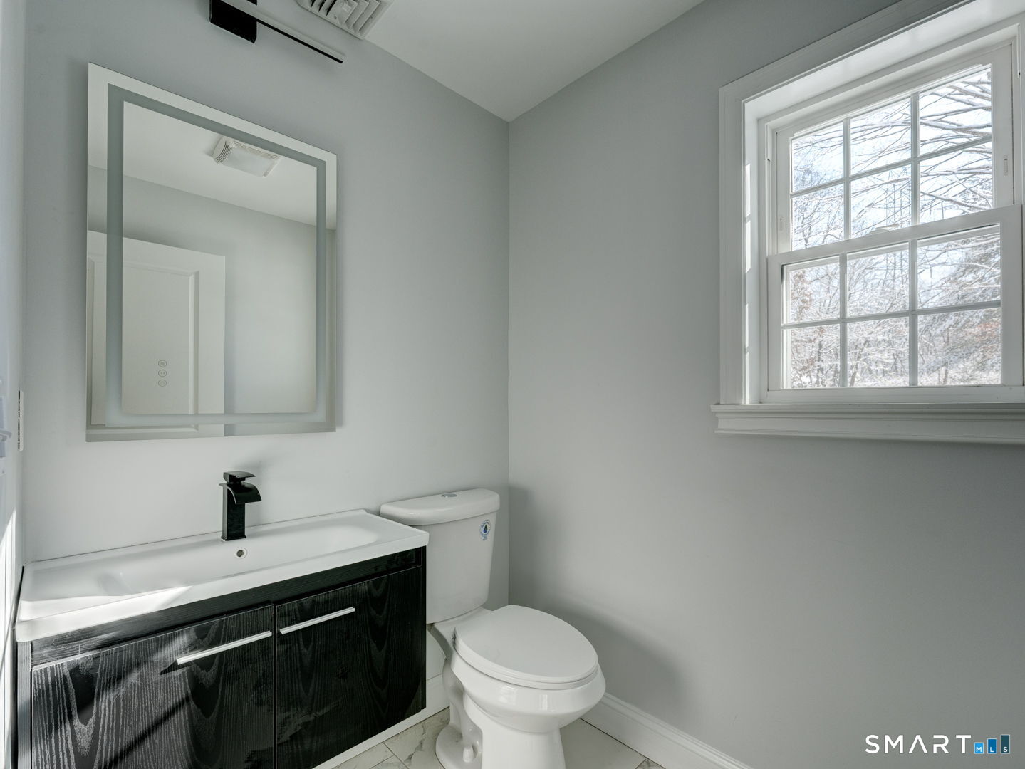 368 Reservoir Road New Britain, CT 06052 - Photo 11 of 32 a bathroom with a sink a toilet and a window