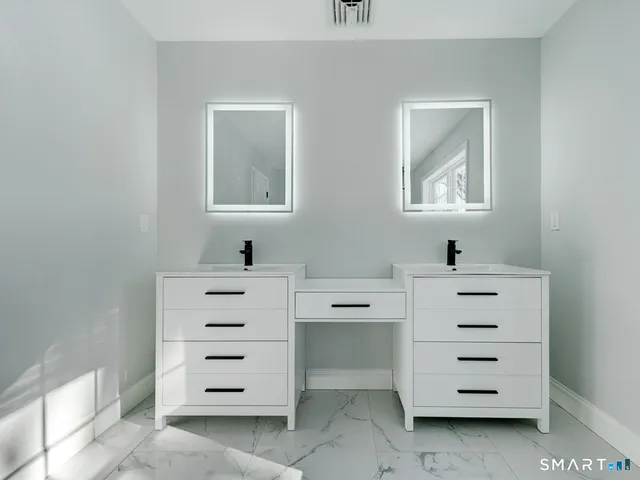 a bathroom with a bathtub and shower