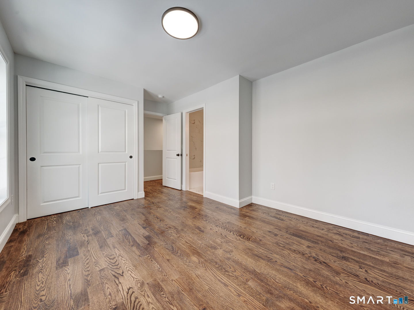 368 Reservoir Road New Britain, CT 06052 - Photo 20 of 32 a view of an empty room and wooden floor