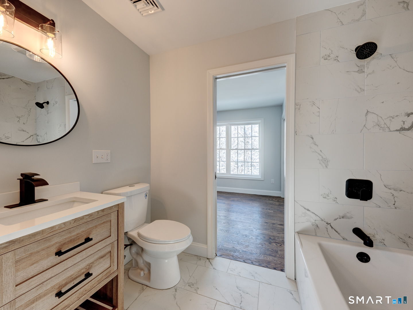 368 Reservoir Road New Britain, CT 06052 - Photo 22 of 32 a bathroom with a sink a toilet and a mirror
