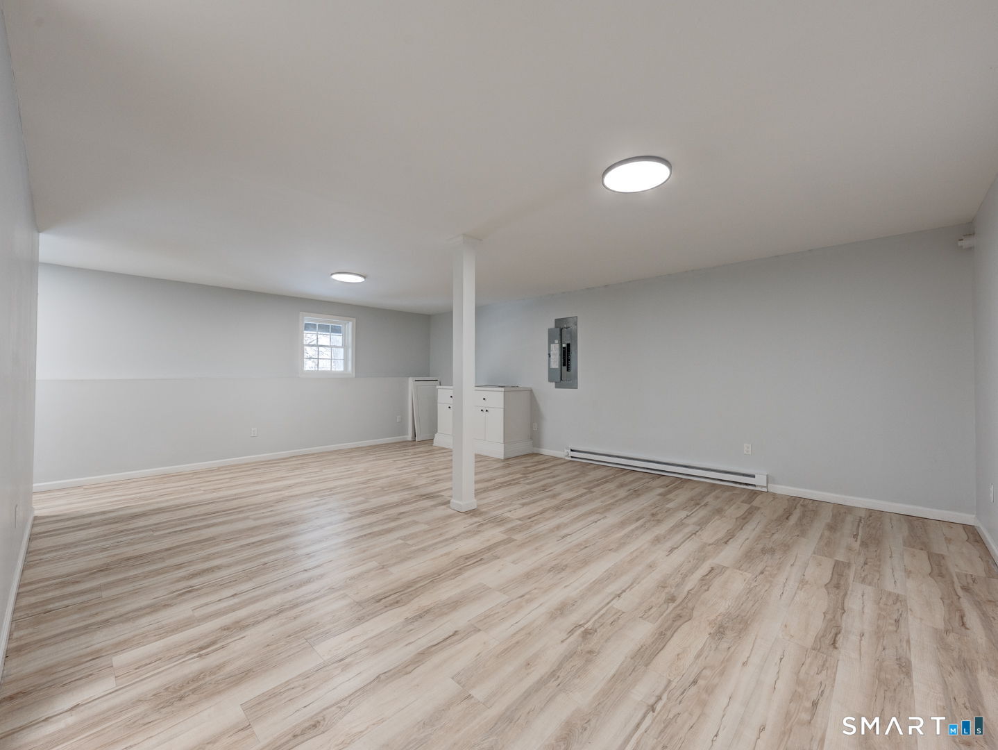 368 Reservoir Road New Britain, CT 06052 - Photo 26 of 32 a view of empty room with wooden floor and fan
