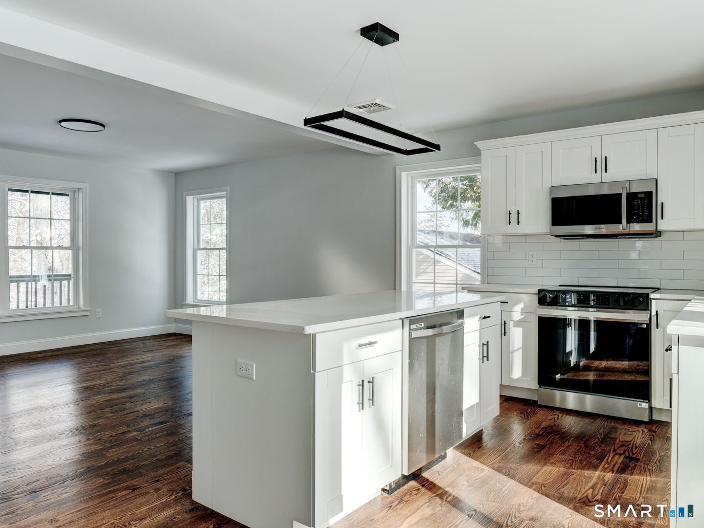 368 Reservoir Road New Britain, CT 06052 - Photo 32 of 32 a kitchen with granite countertop a stove top oven a sink and a microwave