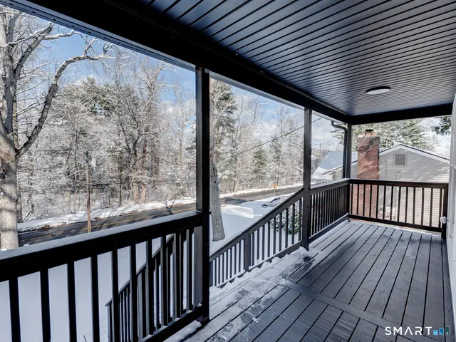 a view of balcony with wooden floor