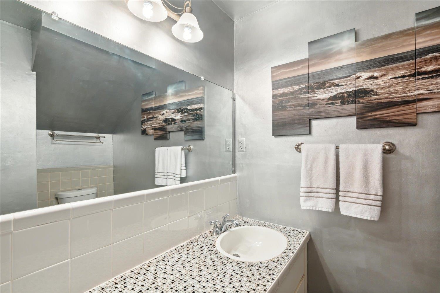 435 North Highland Street, Unit 2 Memphis, TN 38122 - Photo 14 of 26 a bathroom with a sink a vanity and mirror