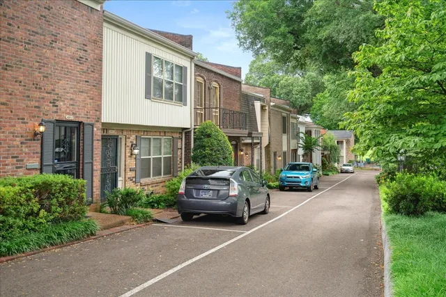 a view of a car park in front of a building
