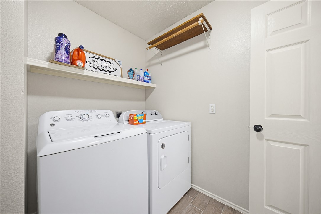1004 La Mirada Portland, TX 78374 - Photo 12 of 23 a utility room with dryer and washer