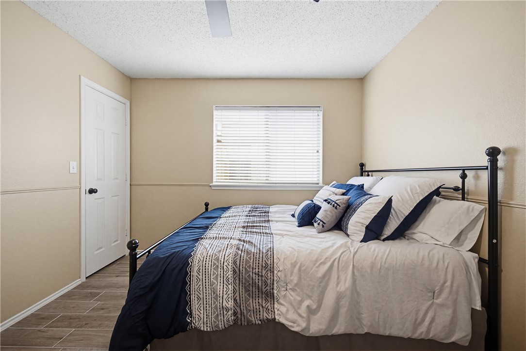 1004 La Mirada Portland, TX 78374 - Photo 13 of 23 a bedroom with a bed and window