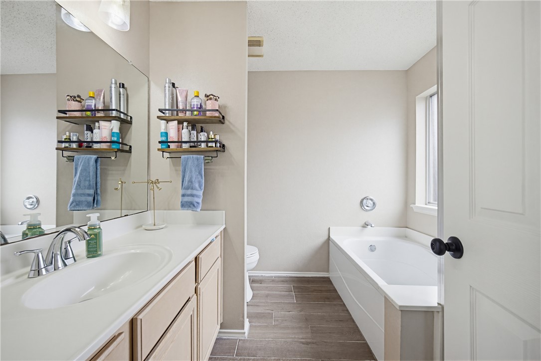 1004 La Mirada Portland, TX 78374 - Photo 17 of 23 a bathroom with a sink and mirror