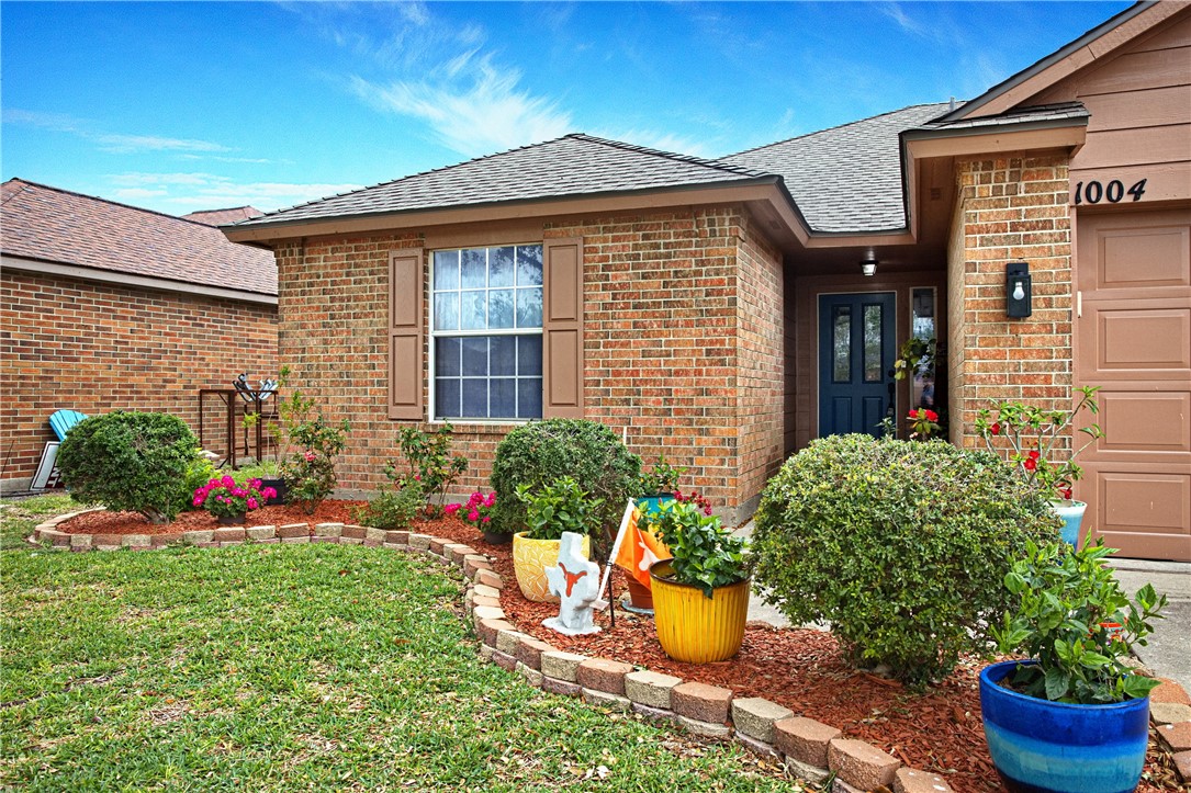 1004 La Mirada Portland, TX 78374 - Photo 2 of 23 a front view of a house with a yard