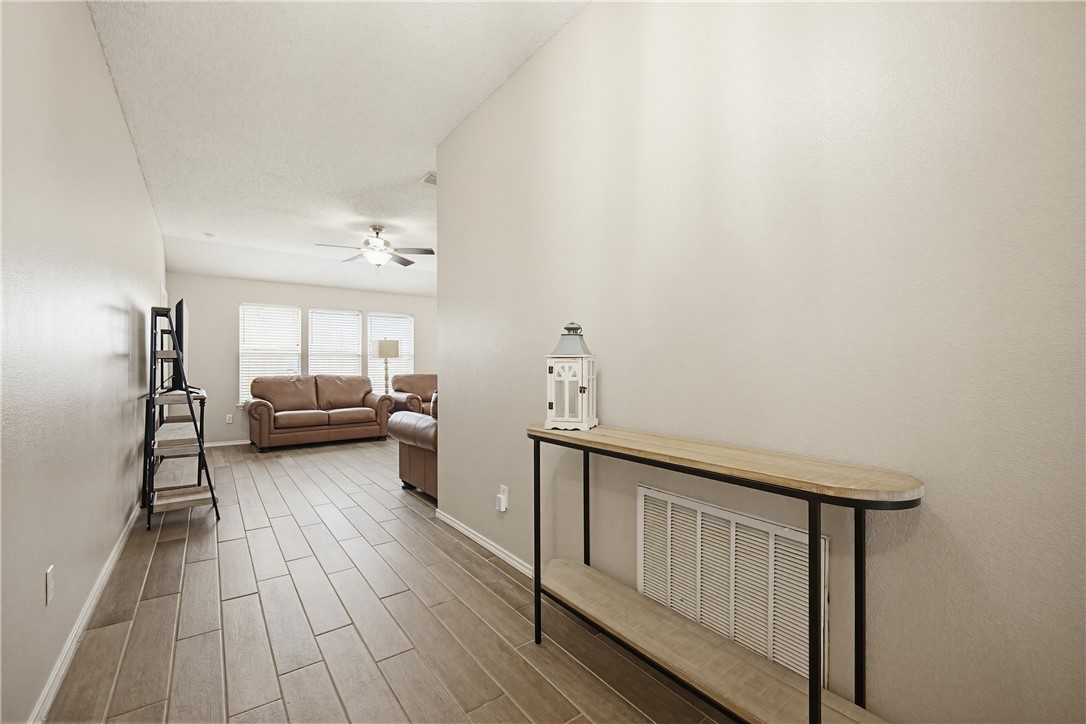 1004 La Mirada Portland, TX 78374 - Photo 4 of 23 a living room with furniture and a wooden floor