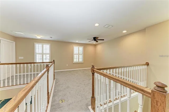 a view of an entryway wooden floor and windows