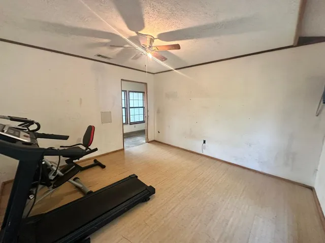 a view of a workspace with furniture