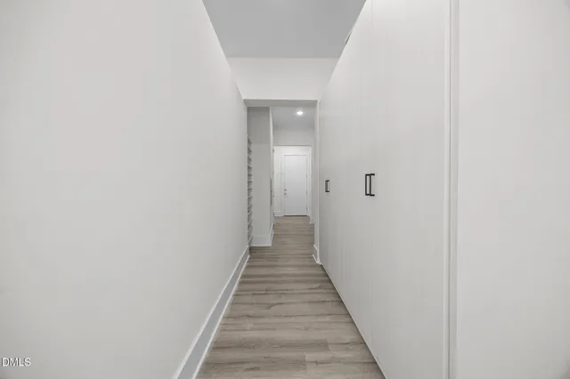 a kitchen with granite countertop a sink and refrigerator